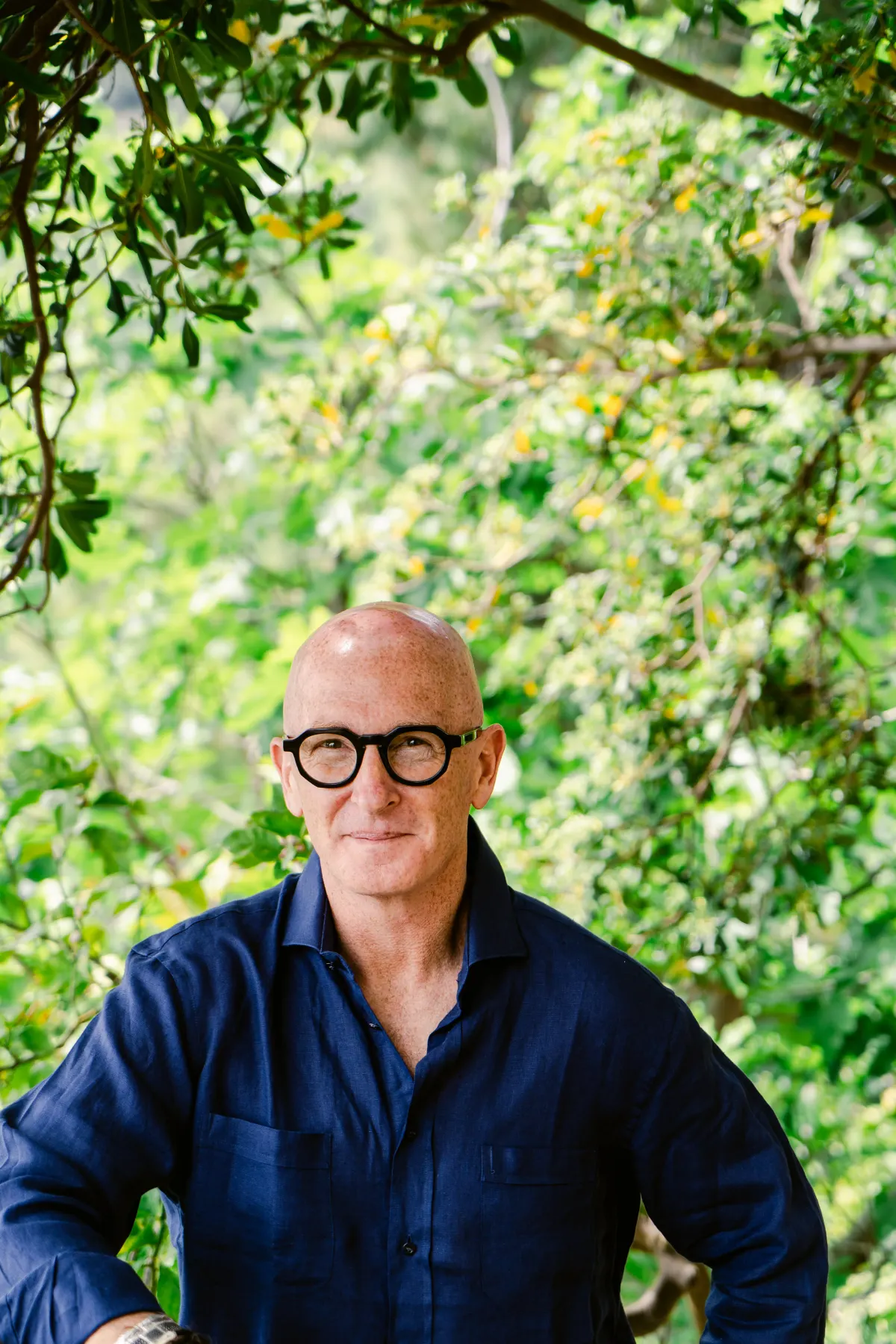 Garden portrait — navy linen, considered.
